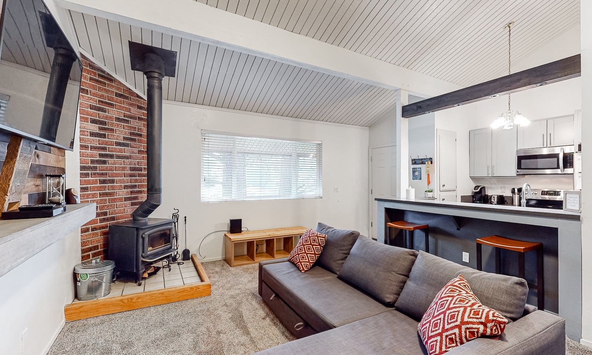 Mammoth Lakes Condo | Charming, two-story ski condo w/a wood stove, free WiFi, shared pool, & hot tub