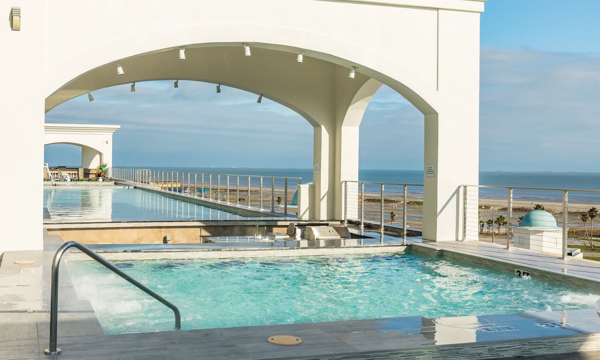 Galveston Apartment | Elegant gulf escape with heated pool, hot tub, beach access, & water views