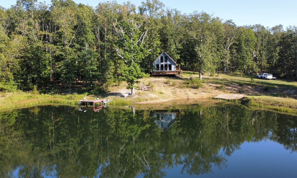 Elk Creek Cabin | Peaceful secluded cabin nestled on 40 wooded acres overlooking 4 acre pond.