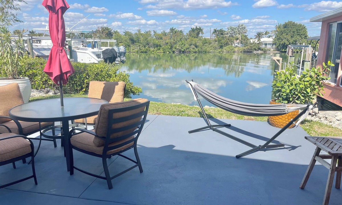 Isles of Capri Apartment | Peaceful Waterfront Efficiency~Dolphins, Manatees and Island Vibes