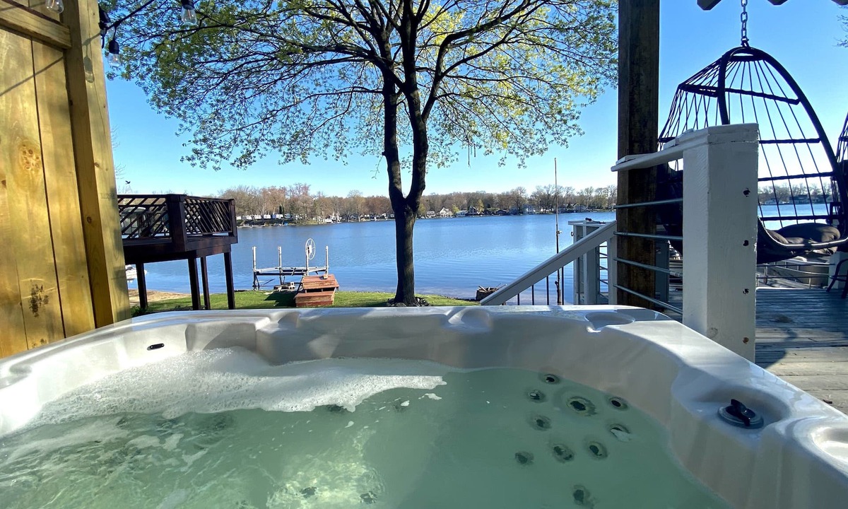 Plainwell House | Pine Lake Retreat- sparkling hot tub! Lakeside house with sandy beach lakefront!