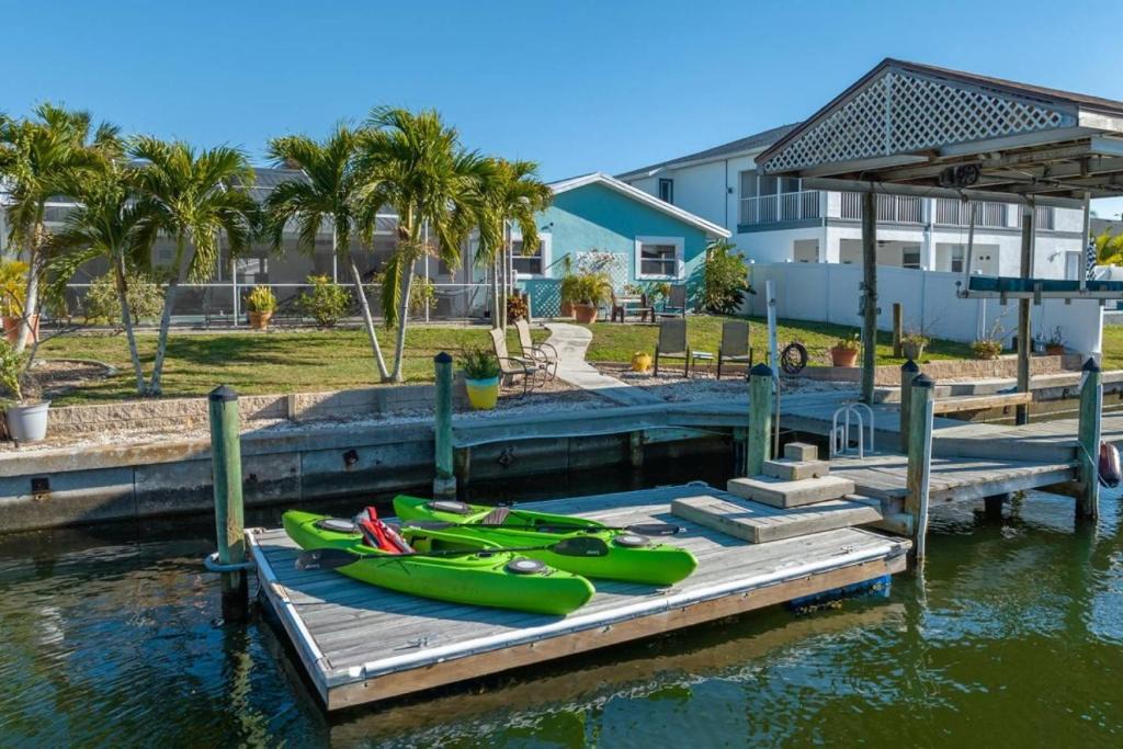 Bal Harbour House | Pirates Den a 4BR Pet-Friendly Waterfront Oasis with Pool, Dock, Personal Water Boats, Fire Pit, Game Room and Bar