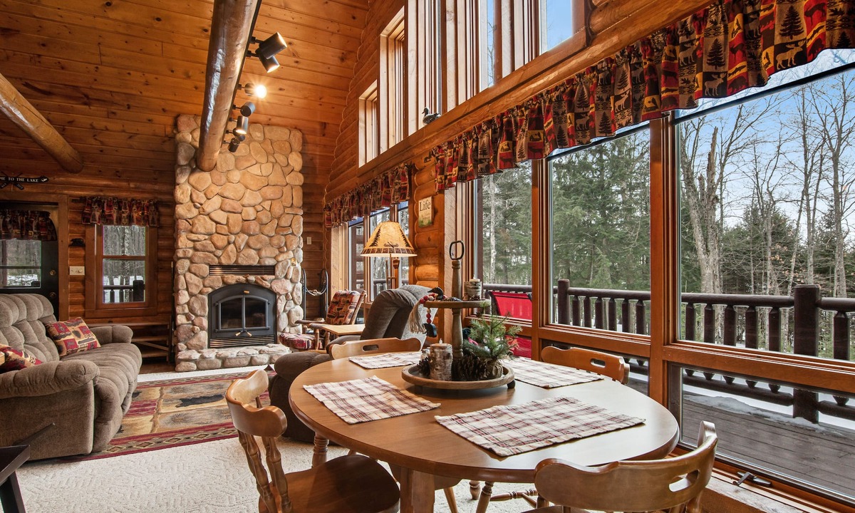 Presque Isle Cabin | Spacious and beautiful lakefront log home on 7 acres with private dock