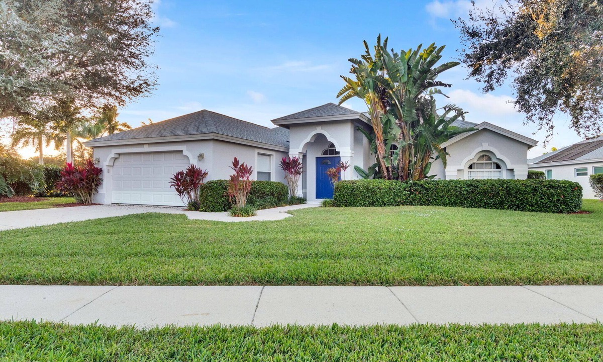 Central Naples House | This 3/2 home enjoys a Southwest facing lakefront view with pool and spa