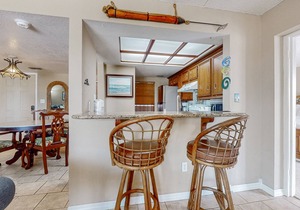 Bay-view all-suite condo with pool & fishing dock - walk to beach