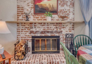 Charming ski condo near slopes with balcony, mountain views, and fireplace