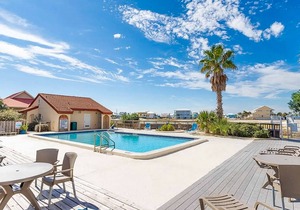 Cozy coastal condo with water view, pool, central A/C, & easy beach access