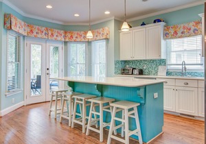Elegant home on the boardwalk with 2 balconies & shared pools - walk to beach