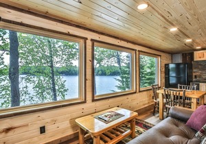 Gorgeous remodeled lakeside cabin with fireplace, personal dock, and sandy beach