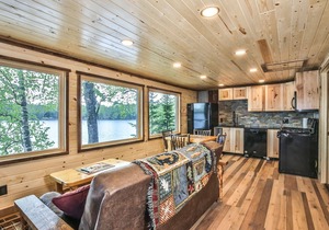 Gorgeous remodeled lakeside cabin with fireplace, personal dock, and sandy beach