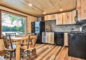 Gorgeous remodeled lakeside cabin with fireplace, personal dock, and sandy beach