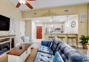 Ground-floor condo with patio, central AC, shared pool, & tennis