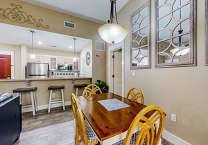 Ground-floor condo with patio, central AC, shared pool, & tennis
