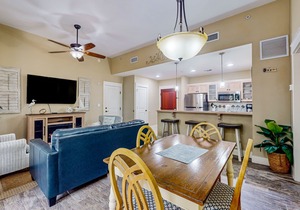 Ground-floor condo with patio, central AC, shared pool, & tennis