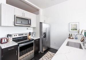 Modern 1BR Apt with Skywalk to Fiserv, Rooftop, and Parking