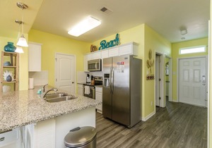 Modern Beachside Townhome with a Playground, Pool, & Kid's Splash Area