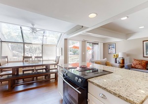 Modern, light-filled villa with 2 living areas, pool, easy beach access, & patio