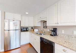 Modern, light-filled villa with 2 living areas, pool, easy beach access, & patio