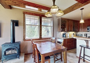 Mountain-view condo on ski shuttle route with deck & fireplace