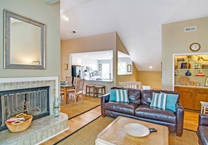 Renovated townhome next to golf course w/community pool access- close to beach