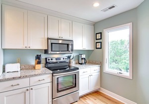 Renovated townhome next to golf course w/community pool access- close to beach