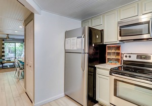 Updated condo with patio, shared pool, and WiFi - walk to Folly Field Beach Park