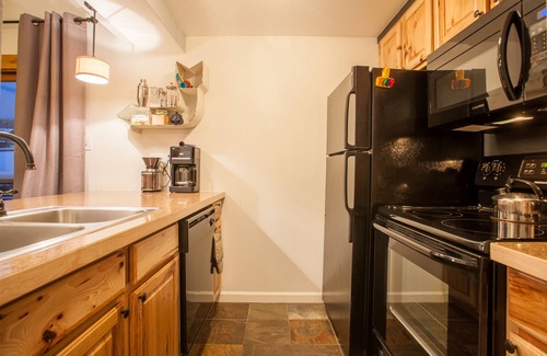 Steamboat Springs Condo | Cozy and Convenient Garden Level Condo. Walk to Lifts. Heated Pool & Hot Tub