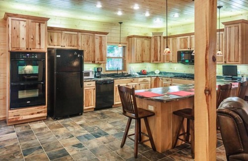 Cosby Cabin | Creekfront cabin with cozy interiors, hot tub & game room.