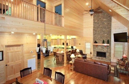 Cosby Cabin | Creekfront cabin with cozy interiors, hot tub & game room.