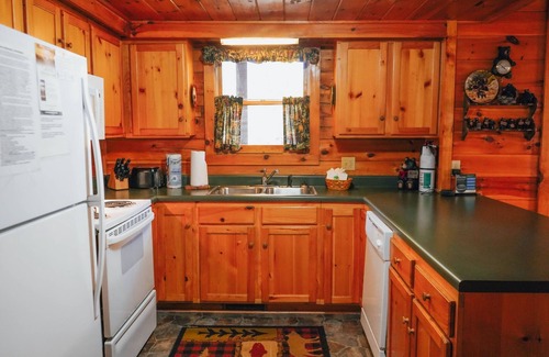 Gatlinburg - Pigeon Forge Cabin | GREAT VALUE! Wildwood Dreams is an enchanting 2 BR, 2 story log cabin