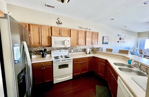 Village of Four Seasons Condo | Lakefront family condo with a screened in balcony on the Lake Of The Ozarks!