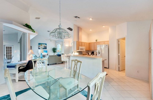 Central Naples House | Light and Bright describes this 3/2 Pool home with long beautiful lake views