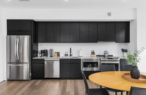 North Capitol Apartment | Luxury on the River - Walk to Downtown, 2 Private Patios & Garage Parking