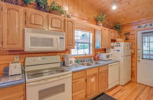 Sevierville Cabin | Romantic escape in the woods w. hot tub, fireplace + indoor pool access