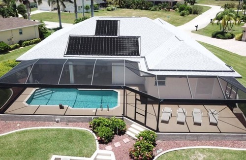 Pelican House | Spacious Waterfront w/Solar Heated Pool Home