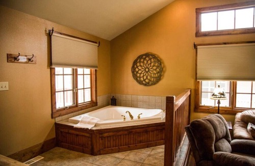 Estes Park Cabin | 1 Bedroom suite with fireplace and jacuzzi tub.