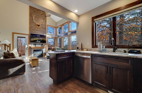 Boyne Falls Condo | 4BR Boyneland Slopeside Disciples Village Condo | Fireplace| Ski Cubbies