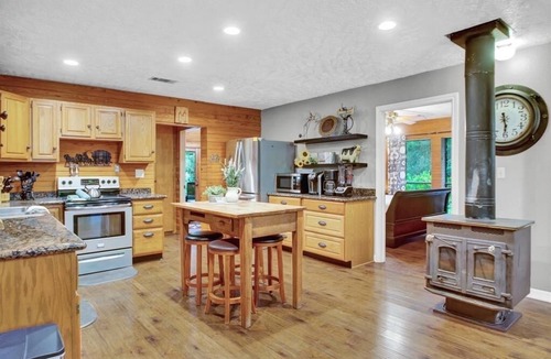 Tomball Cottage | 8 acres of fun & relaxation in a beautiful Rock Cottage with a pool and hot tub