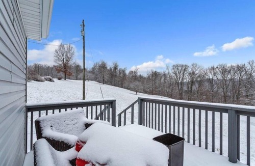 Sharpsburg House | 8700 Wood Rd, Chesterhill, OH - Property with a small cabin and a single family home