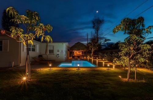 Boynton Beach House | Boho Tiki Villa w Heated Saltwater Pool, King Beds & 6TVs