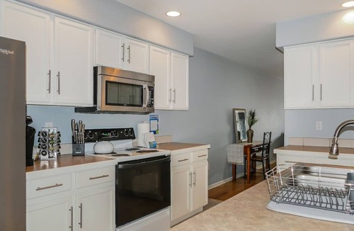 University Hills House | Charming Family Home with Cozy Retreat with comfy beds near all Denver fun.