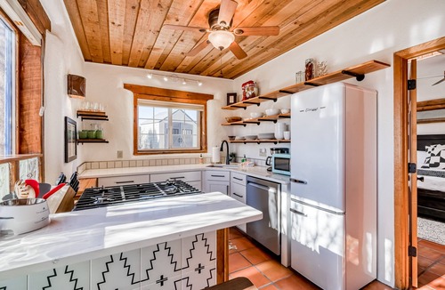 Taos House | Colorful dog-friendly home with sweeping views, a private hot tub, & large yard