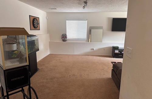 Los Lunas House | Cozy large home with. Downstairs with a closed door will be the rented space