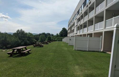 Weirs Beach Apartment | Cute Lower Level Cedar Lodge Room with Balcony & Lake Views!