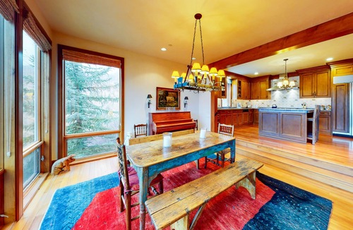 West End House | Elegant Aspen townhouse with an inviting deck, fireplace, and washer/dryer