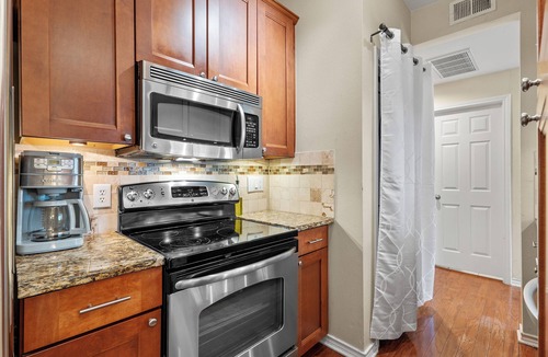 North University Condo | Elegant, Quiet, and Beautiful Rustic Home Blocks from UT and Downtown