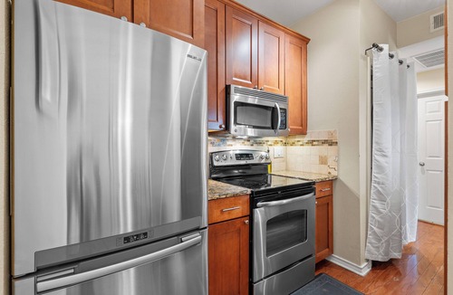 North University Condo | Elegant, Quiet, and Beautiful Rustic Home Blocks from UT and Downtown