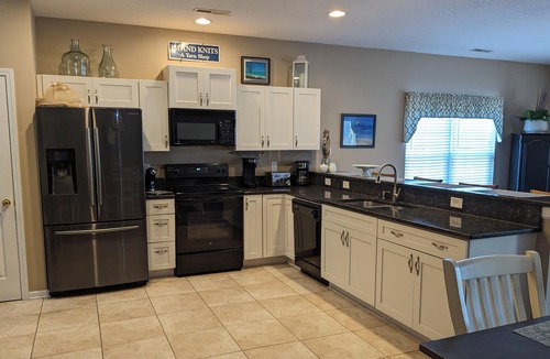 Garden City House | Enjoy your own private pool or take a quick walk to the beach! Sleeps 10