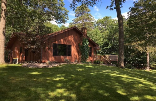 Eagle River House | Escape to the Northwoods at this picturesque Sand Lake home