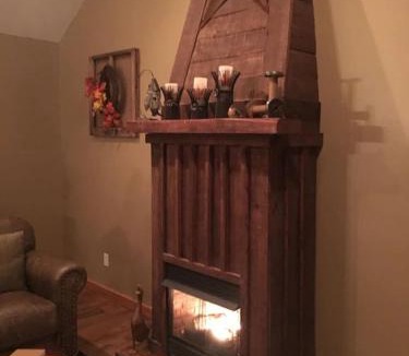 Spencer House | Gas fireplace, firepit, and cedar Adirondack chair